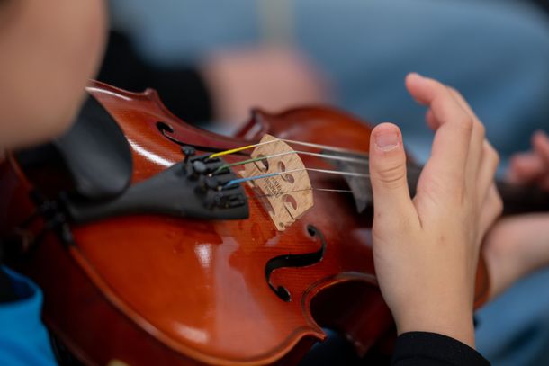 A viola being played by a child