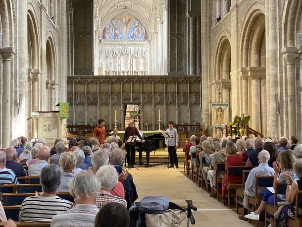 Musicians playing in the Priory at Christchurch