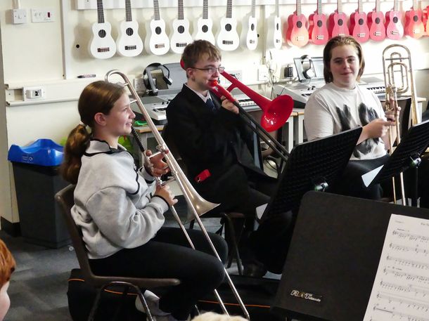 Kids learning the brass instruments